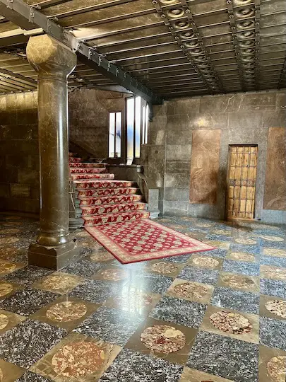 The central staircase of Gaudí's Palau Guell is richly decorated with expensive black marble.