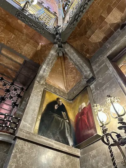In the corner of the central hall of Gaudí's Palau Guëll you will find magnificent religious paintings.