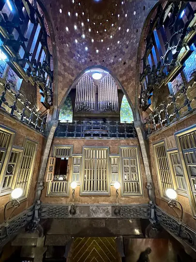 The central hall of Gaudí's Palau Guëll has an impressive dome and features a massive organ.